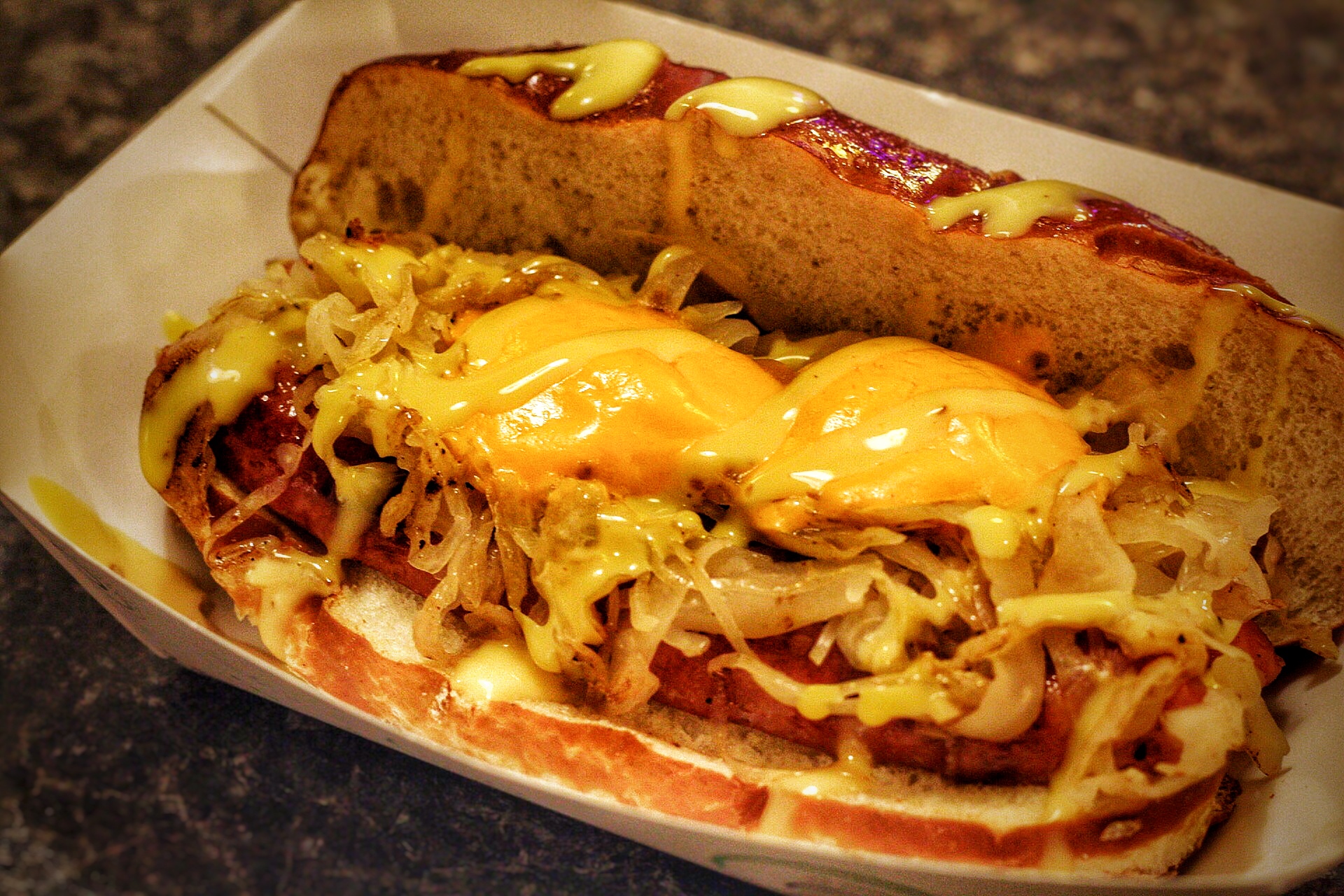 Pictured here: Don’t Hassle the Hoff Wiener featuring Smith’s Cheddarbest, Kraut, Horsey Cheddar Sauce, Honey Mustard on a Buttery, Salted Pretzel Bun.